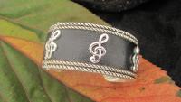 Silver and Black Leather Cuff Bangle with G Clef Design